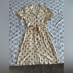 Mid length dress for spring summer has buttons in the front with pockets